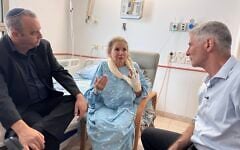Democrats party chair Yair Golan (right) and MK Gilad Kariv (left) visit photojournalist Heidi Levine, who was attacked in the West Bank on October 16, in the hospital on October 18, 2026.