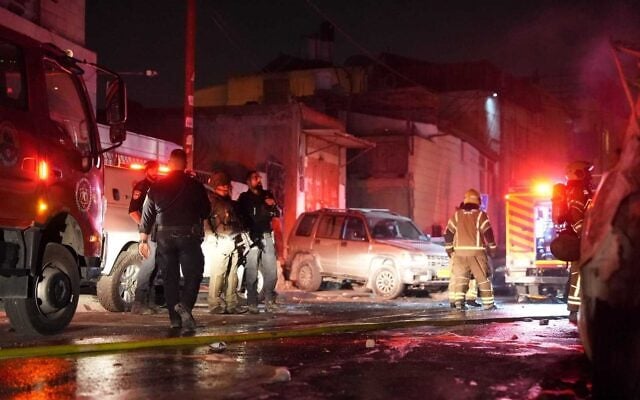 Police and firefighters work at the scene of a riot in East Jerusalem's Abu Tor neighborhood on October 15, 2026. (Israel Police)