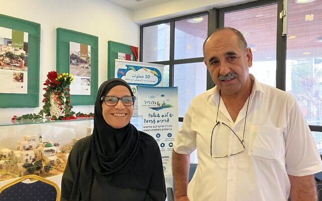 Samia Zina, left, and Mazra'a Mayor Fuad Awad at a polling station in Mazra'a on October 27, 2026. (Diana Bletter/Times of Israel)