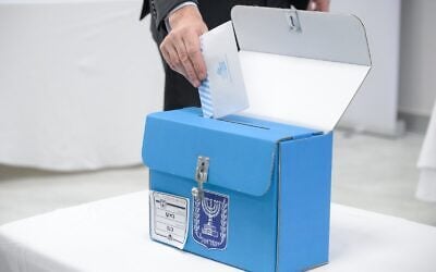 Israeli Ambassador to Azerbaijan Ronen Kraus casts a ballot at the Israeli embassy in Baku as voting opens for diplomats abroad ahead of the October 27 election, on October 15, 2026. (Maayan Toaf/GPO)