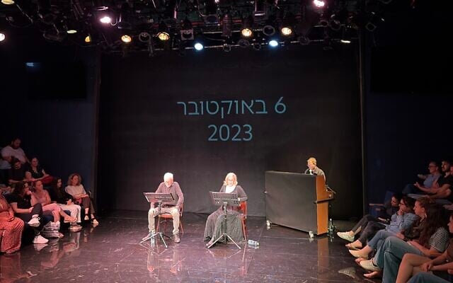 Actors Moni Moshonov and Sandra Sade perform the reading of a play about former hostages Aviva and Keith Siegel, October 6, 2026. (Jessica Steinberg/Times of Israel)
