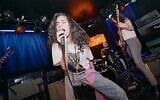 Raz Shifer of Ramat Gan, a Nova Festival survivor, performs at LA's Viper Room in a scene from 'The Bridge,' a documentary about Israeli trauma survivors and their week at Rock ’n Roll Fantasy Camp. (Courtesy Rockcamp.com via JTA)