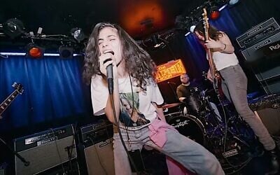Raz Shifer of Ramat Gan, a Nova Festival survivor, performs at LA's Viper Room in a scene from 'The Bridge,' a documentary about Israeli trauma survivors and their week at Rock ’n Roll Fantasy Camp. (Courtesy Rockcamp.com via JTA)