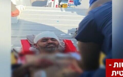 Wounded flydubai Flight 1073 Captain Smit Machchhar is taken off the plane after it made an emergency landing in Tabuk, northwetern Saudi Arabia, on September 30, 2026. (Channel 12 screenshot, from footage used in accordance with clause 27a of the copyright law)
