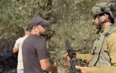 A soldier orders a Palestinian to exit an olive grove in Beita, near Nablus in the northern West Bank, on October 2, 2026. (Screen capture: X, used in accordance with Clause 27a of the Copyright Law) A soldier orders a Palestinian to exit an olive grove in Beita, near Nablus in the northern West Bank, on October 2, 2026. (Screen capture: X, used in accordance with Clause 27a of the Copyright Law)