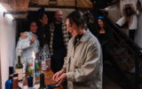 Rabbi Rebecca Carrillo lights candles at ILUMINA, Jewtina y Co.'s annual Hanukkah event, in Los Angeles, December 2024. (Cinthiya Silverstein via JTA)