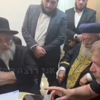 A screengrab of a video showing Achi party spiritual leader Haim Yosef Abergel (Left) making a deal with Education Minister Yoav Kisch (Right), while Prime Minister Benjamin Netanyahu joins on the phone, published by Channel 13 on October 25, 2026, (Channel 13)