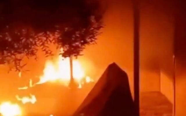 A still image from footage of a building on fire after an alleged settler arson attack in the South Hebron Hills, in the southern West Bank, on October 30, 2026. (Screenshot via X, used in accordance with Clause 27a of the Copyright Law)