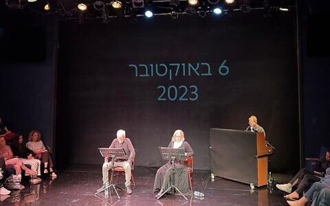 Moni Moshonov, left, and Sandra Sade, right, play ex-hostages Keith and Aviva Siegel during a reading at Habima National Theater on October 6, 2026 (Jessica Steinberg/Times of Israel)