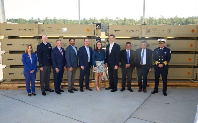 From right to left: IDF military attaché in Washington Maj. Gen. Tal Politis; Rafael Senior Vice President and head of its Air Defense Division Shlomo Toaff; Homa Directorate head Moshe Patel; Arkansas Senator Tom Cotton; Arkansas Governor Sarah Huckabee Sanders; Raytheon head of Air and Land Systems Tom Liberty; R2S CEO Jonathan Casey; Arkansas Congressman Bruce Westerman; US Missile Defense Agency deputy director Maj. Gen. Jason Cothern; and Israel’s Consul General to the Southwest United States, Adi Farjoon, at a ceremony commemorating the the first Iron Dome interceptor to be fully built and assembled in the United States, East Camden, Arkansas, October 8, 2026. (Defense Ministry)