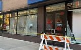 A CapitalOne bank location vandalized with anti-Israel graffiti, in New York City, October 19, 2026. (Courtesy)