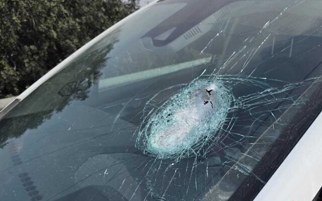 A car that was hit by a stone on Route 60 highway near the West Bank settlement of Rehelim, October 27, 2026. (Magen David Adom)
