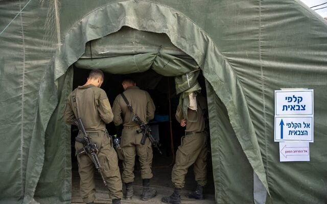 IDF troops vote in Israel's national elections at a military base in the Gaza Strip, in a handout photo published on October 26, 2026. (Israel Defense Forces) IDF troops vote in Israel's national elections at a military base in the Gaza Strip, in a handout photo published on October 26, 2026. (Israel Defense Forces)