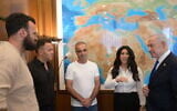 Prime Minister Benjamin Netanyahu meets with survivors of the flydubai flight that was attacked, October 1, 2026. (Amos Ben Gershom/GPO)