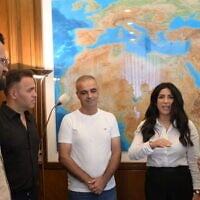 Prime Minister Benjamin Netanyahu meets with passengers who helped thwart a copilot's September 30, 2026, attack on a flydubai plane, at his office on October 1, 2026. (Amos Ben Gershom/GPO)