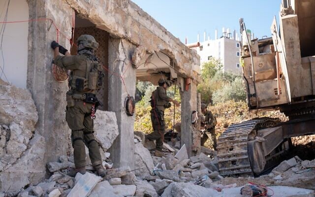 Israeli security forces demolish the home of the Palestinian terrorist who killed Netanel Shukrun in a shooting attack near the West Bank settlement of Neve Tzuf, October 7, 2026. (Israel Defense Forces)