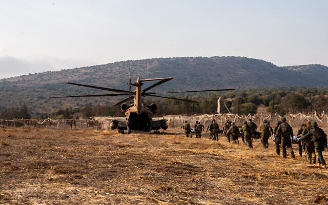 IDF soldiers and a helicopter at the scene of a deadly explosion of an unexploded Hezbollah ordnance during a school hike in the Ramim Ridge area in northern Israel, close to the border with Lebanon, October 12, 2026. (Israel Defense Forces)