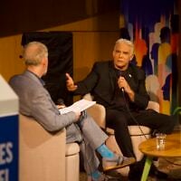 Opposition leader Yair Lapid (right) speaking with Times of Israel founding editor David Horovitz in Tel Aviv, October 12, 2026. (The Times of Israel)