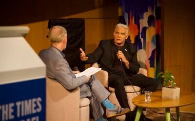 Opposition leader Yair Lapid (right) speaking with Times of Israel founding editor David Horovitz in Tel Aviv, October 12, 2026. (The Times of Israel)
