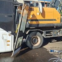 A bus and tractor are seen after a crash on Route 25 in southern Israel on October 30, 2026. (Magen David Adom)