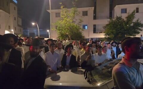 Ultra-Orthodox rioters gather to prevent the arrest of a military draft dodger in Modiin, October 6, 2026. (X screenshot/Josh Breiner)