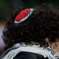 A person wears a watermelon-style kippah, a symbol of solidarity with Palestinians. (Paul Frangipane / AFP / Getty Images via JTA)
