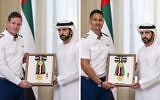 Pilots Rowan Tooth (L) and Henson Steven, who helped land a flyDubai plane following an attempted terror attack, receive honorary awards in Dubai, Untied Arab Emirates, October 27, 2026. (Emirates News Agency -- WAM/used in accordance with Clause 27a of the Copyright Law)