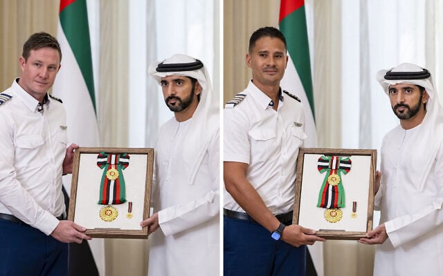 Pilots Rowan Tooth (L) and Henson Steven, who helped land a flyDubai plane following an attempted terror attack, receive honorary awards in Dubai, Untied Arab Emirates, October 27, 2026. (Emirates News Agency -- WAM/used in accordance with Clause 27a of the Copyright Law)